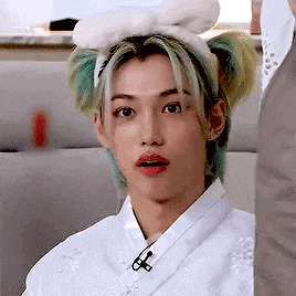 a close up of a person wearing a bunny ear headband .