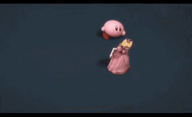 a cartoon character named kirby is standing in a stadium