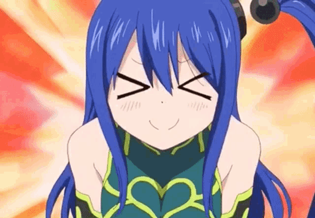 a girl with blue hair and a heart on her chest is smiling and making a face .