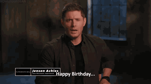 a man in a black shirt that says jensen achles happy birthday