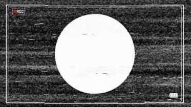 a white circle is in the middle of a black background with a red rec button .