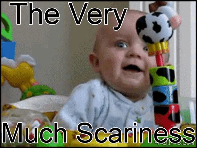 a baby holding a stuffed animal with the words " the very much scariness " on the bottom