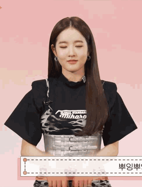a girl wearing a black shirt that says global standard