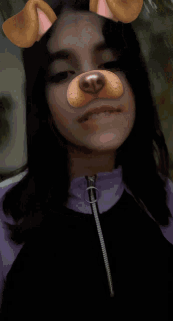 a girl wearing a dog face mask with ears