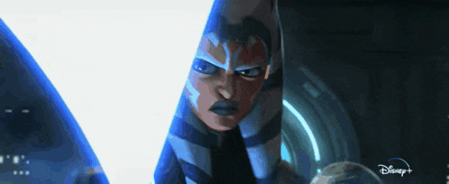 a close up of a person holding a light saber with a disney logo in the corner