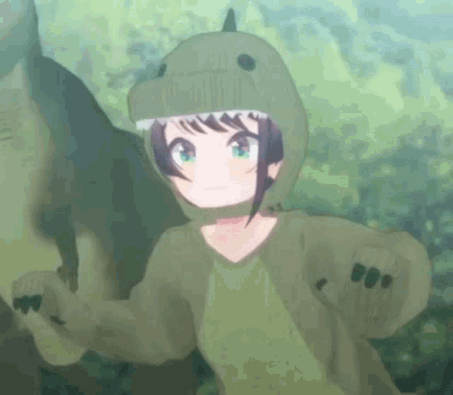 a girl is wearing a dinosaur costume and standing next to a dinosaur .