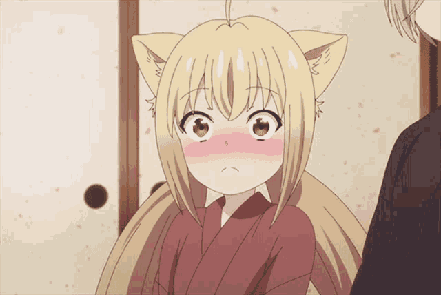a girl with cat ears and a surprised expression on her face
