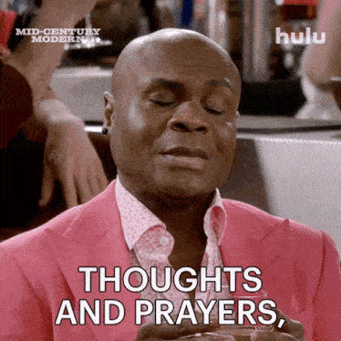 a bald man in a pink suit says " thoughts and prayers "