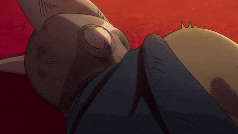 a close up of a person 's hands with the letter u on their chest