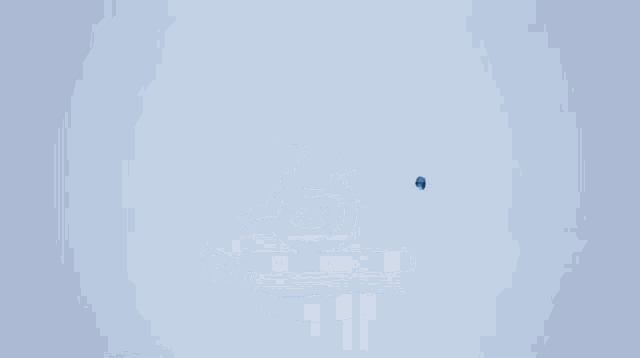 a blue glass globe floating in the air on a blue background