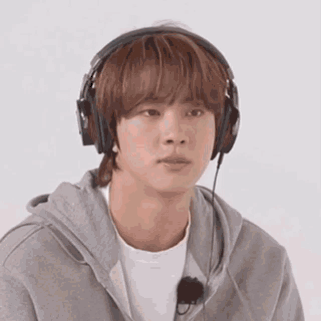 a close up of a person wearing headphones .