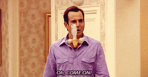 a man in a purple shirt is holding a chicken in his mouth and says `` oh , come on '' .