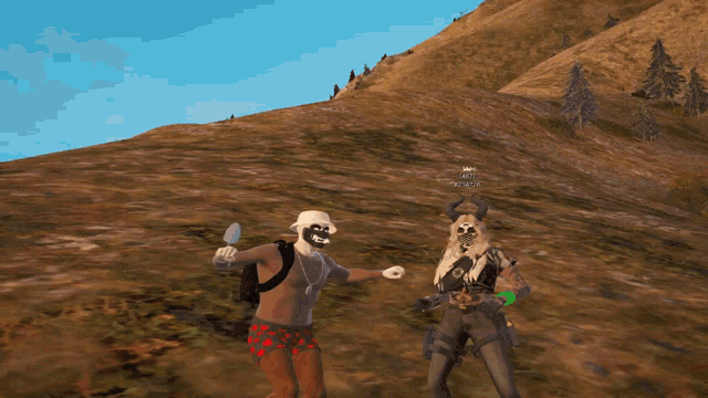 a man wearing a mask is standing next to another man wearing a mask and a skull with horns