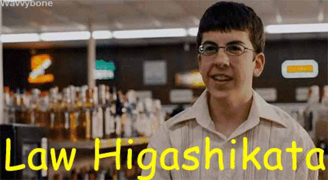 a young man with glasses stands in front of a sign that says law higashikata