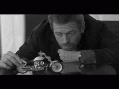 Bored Hugh Laurie GIF - Bored Hugh Laurie Bike GIFs