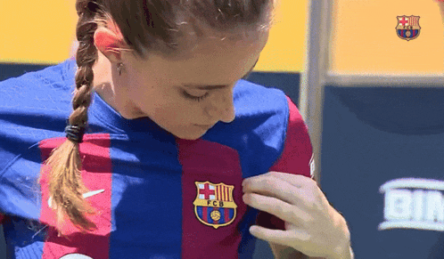 a woman is wearing a shirt that says fcb