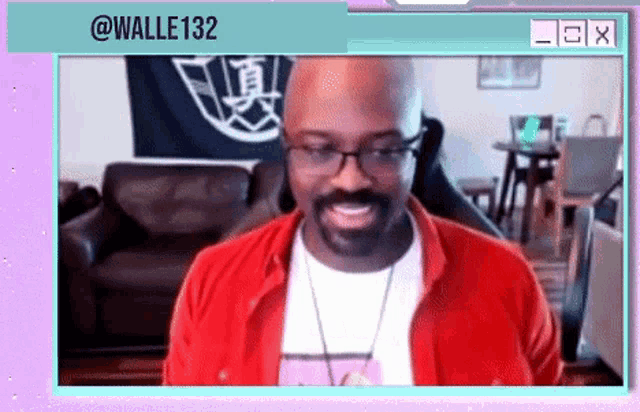 a man wearing glasses and a red jacket is smiling in front of a purple background with the name halle132 on it