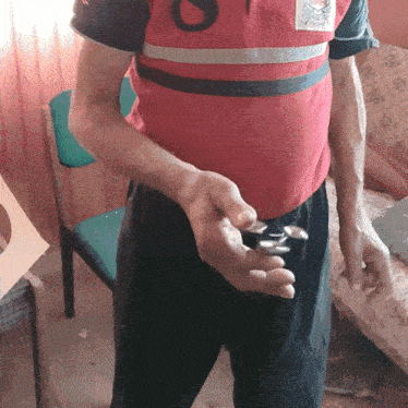 a man wearing a red shirt with the number 8 on the front