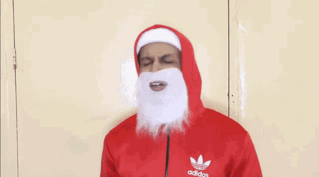 a man dressed as santa claus is holding a toy car and says " the thing you just asked here you go "