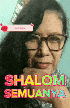 a woman wearing glasses with the words shalom semuanya written on her face