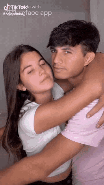 a man and a woman are hugging each other with a tiktok app on the bottom