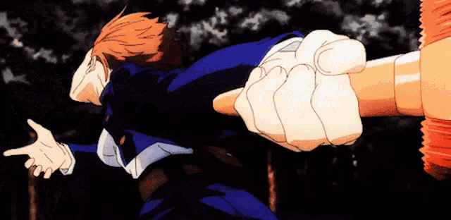 a close up of a person holding a large object in their hand