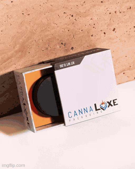a cannaluxe packaging box sits on a white table