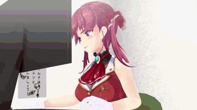 a girl with red hair is sitting in front of a computer