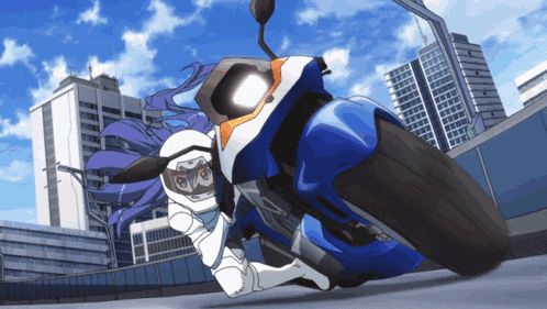 a person riding a blue and white motorcycle with buildings in the background