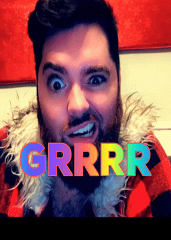 a man with a beard is wearing a plaid jacket and the word grrrr is above him