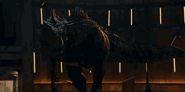 a dinosaur is standing in a dark room with a sign that says exit