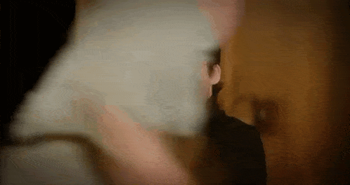 a close up of a person holding a piece of paper .
