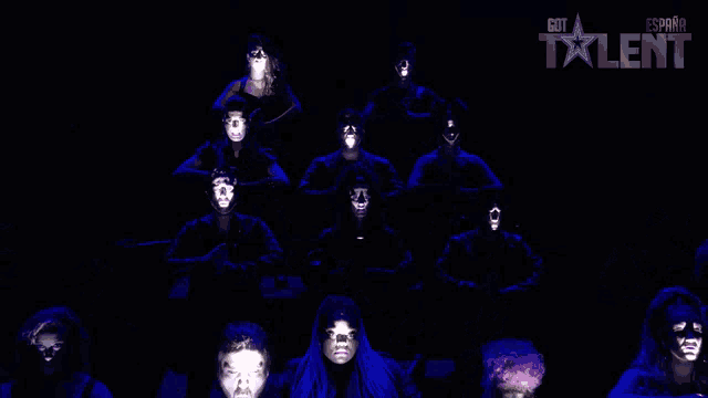 a group of people with their faces projected on a screen that says got talent on it