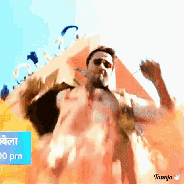 a man is dancing in front of a sign that says saturday at 7:00 pm