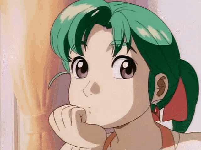 a girl with green hair and purple eyes is looking at the camera