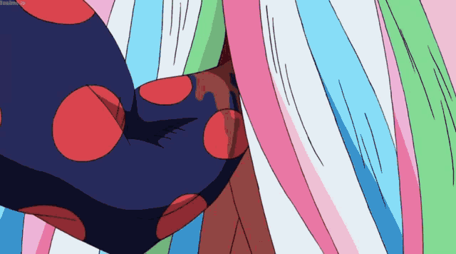 a close up of a cartoon character 's arm with red polka dots