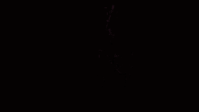 a girl wearing a campbell jersey stands in the dark