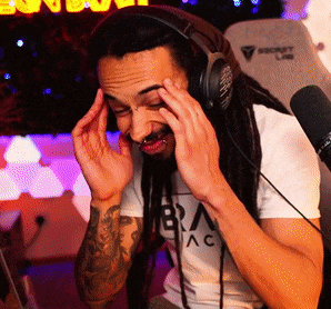 a man with dreadlocks is wearing headphones and a shirt that says bra ac