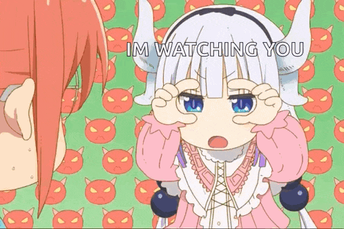 a little girl with horns is making a funny face while another girl looks on .