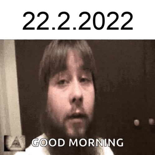 a man with a beard says good morning in front of a door