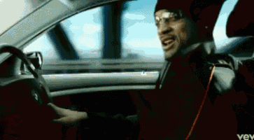 a man is driving a car with the word vev on the bottom of the screen