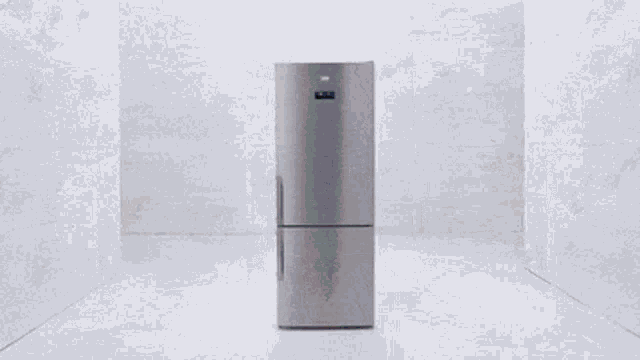 a stainless steel refrigerator with the door open and full of food