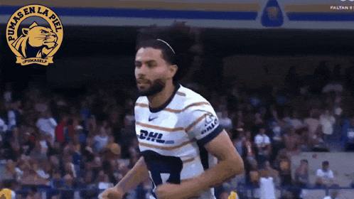 a man wearing a pumas en la piel jersey