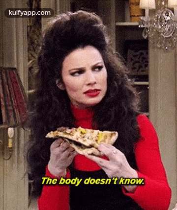 a woman is holding a slice of pizza in her hands and saying `` the body does n't know '' .