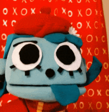 a stuffed animal in front of a red background that says xoxox