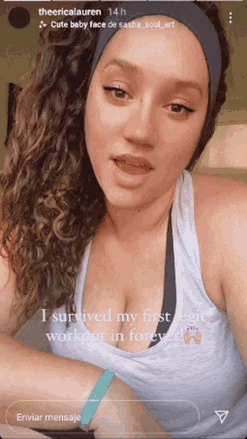 a woman with curly hair is wearing a headband and a white tank top