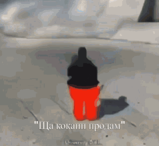 a blurry picture of a person in a red shirt with the words " sha kokain prodam " written below it