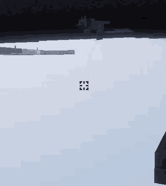 a cat is hanging from a rope in a minecraft video game .