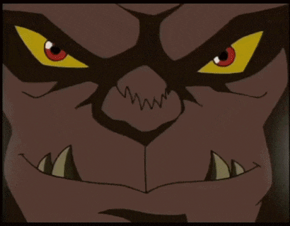 a close up of a cartoon character 's face with horns and red eyes