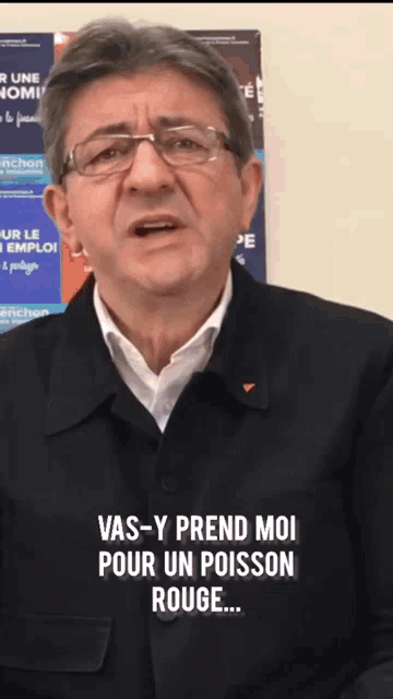 a man wearing glasses and a black jacket says " vas-y prend moi pour un poisson rouge ... "